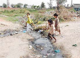 Nullahs filled to the brim with dirty water and garbage at Jugiana village near Doraha
