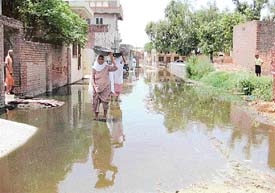 A pool of stagnant water reflects the apathy of the authorities concerned towards the residents of Mangewal village in the Malaudh block of Mandi Ahmedgarh